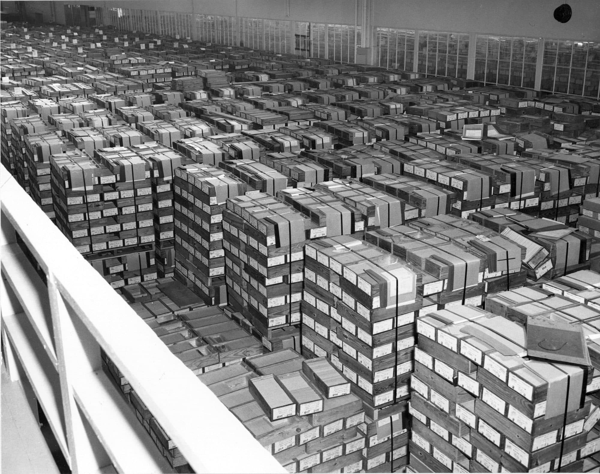 Rows of boxed punched-card records stacked across a federal records center floor, 1959.